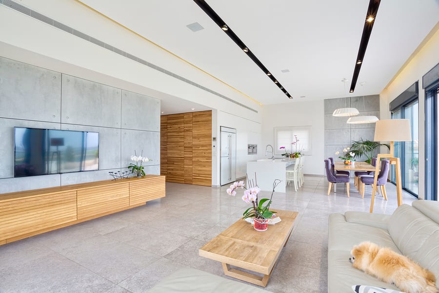 Living Room With Decorative Wall, Leather Furniture And Television